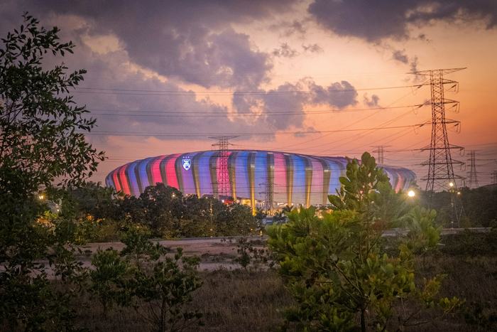 Sultan Ibrahim Stadium in Iskandar Puteri, Johor, lit up at dusk