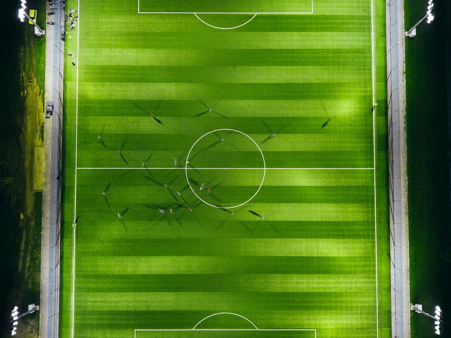 A floodlit football pitch at night in Kuantan, seen from directly above
